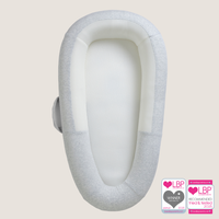 purflo Sleep Tight Baby Bed in Minimal Grey, shown from above with a light grey cover, white inner panels and side carry handle. Loved By Parents Awards Platinum Best Sleep Aid